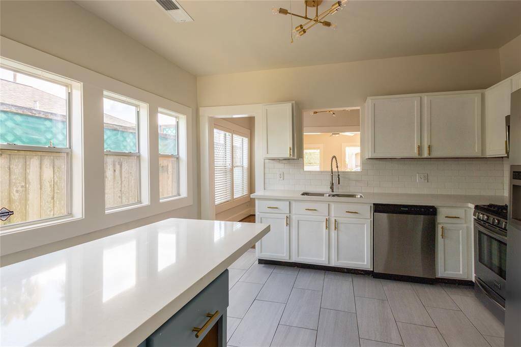 Another view of kitchen showing the extra counter space ideal for quick meals!