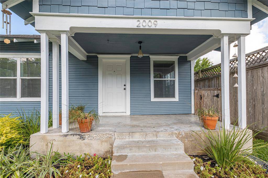 Front porch with room for furniture to sit around with friends and family!