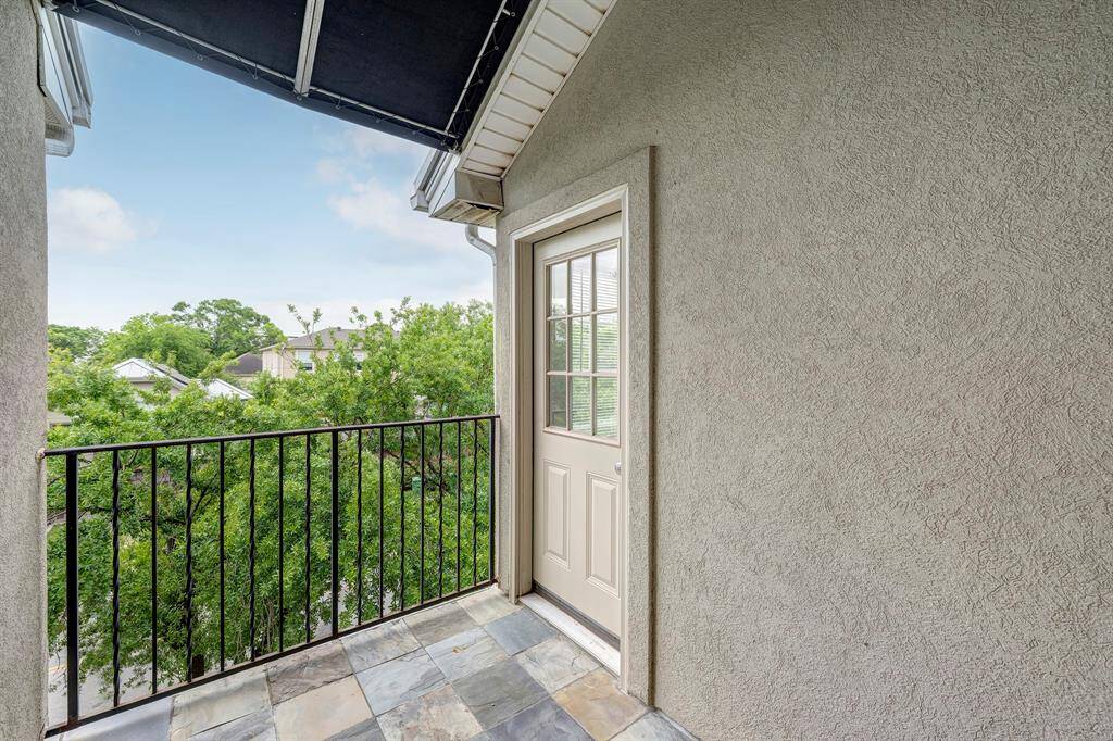The guest bedroom and primary bedroom can access this balcony that faces south.