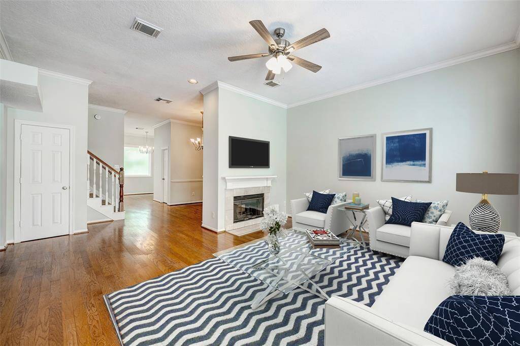 Large living room with good wall space for a large TV! Virtually staged photo.
