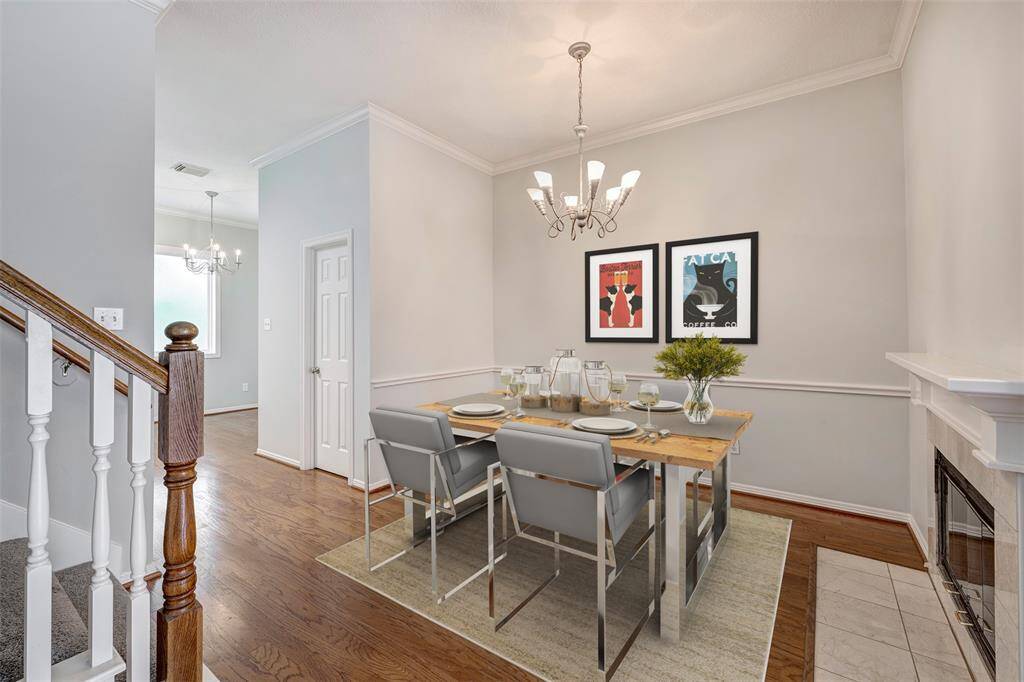 Dining room with fireplace. Virtually staged photo.