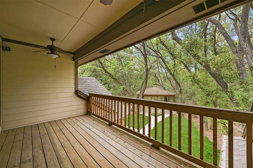 Step out the French doors in the gameroom onto the breezy balcony to enjoy the fabulous view of the backyard which includes a wooded perimeter and a manicured center anchored by a fabulous gazebo with an in-ground spool (spa/pool).