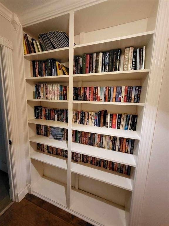 Built-in bookshelf in downstairs hallway