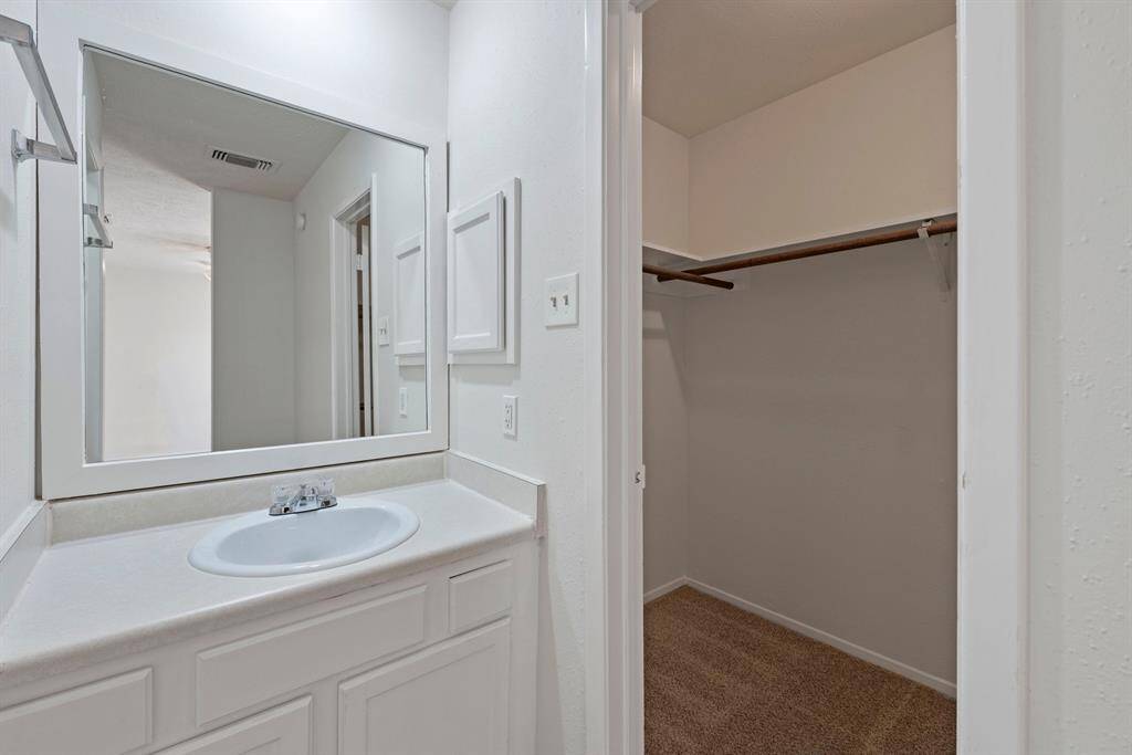 Primary bedroom has private bath with separate vanity.