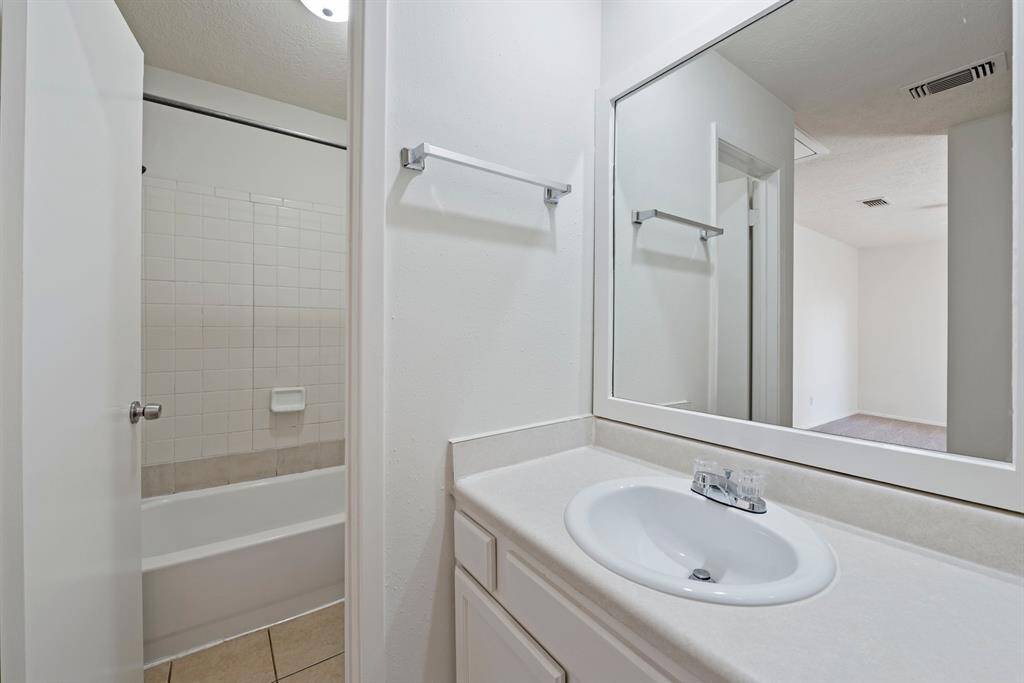 Shower/tub area in primary.