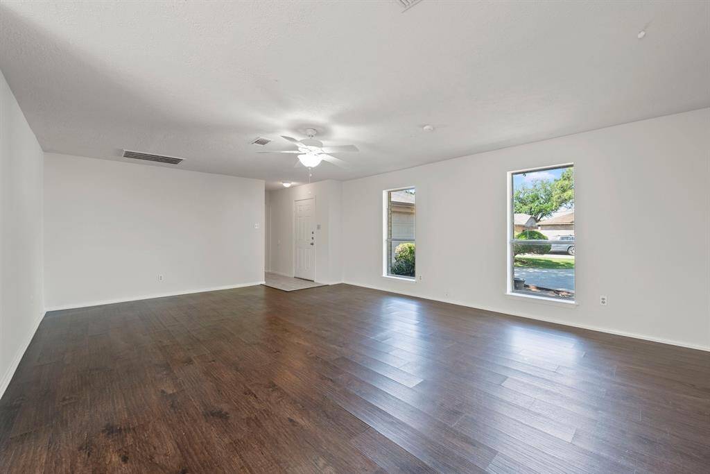 Look at the natural light and gleaming hard surface floors that greet you as you enter.