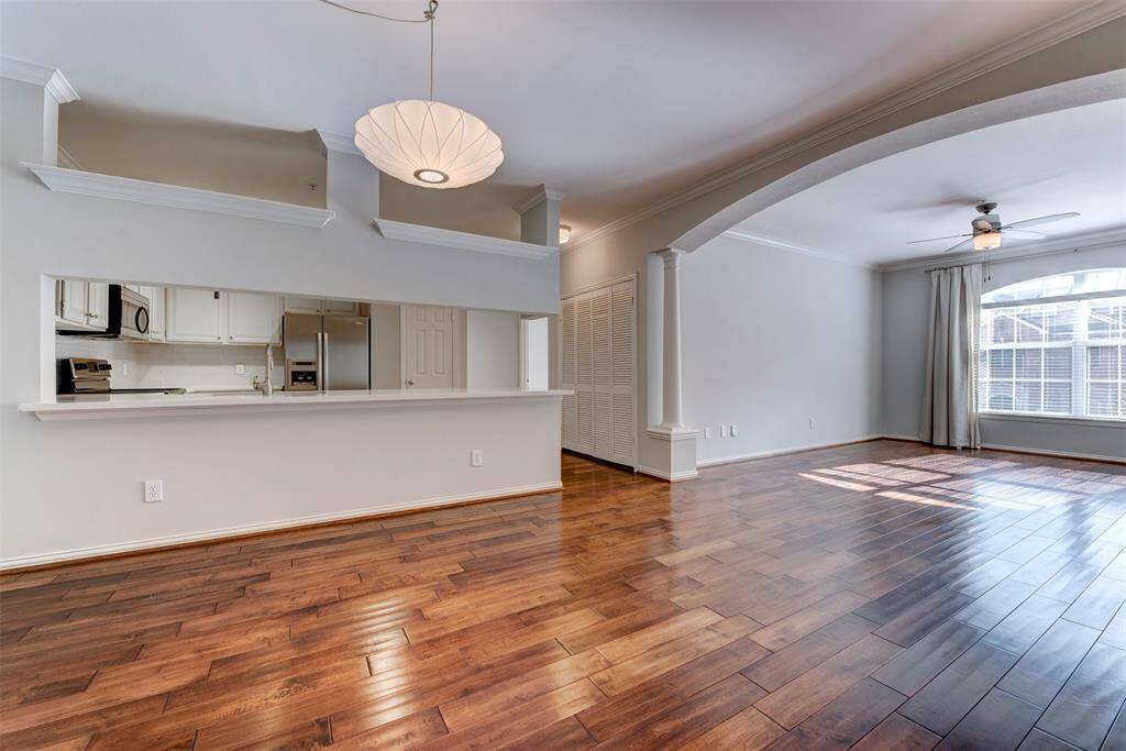 The modern kitchen offers a sleek stainless steel appliance package, and a breakfast bar that seats four.