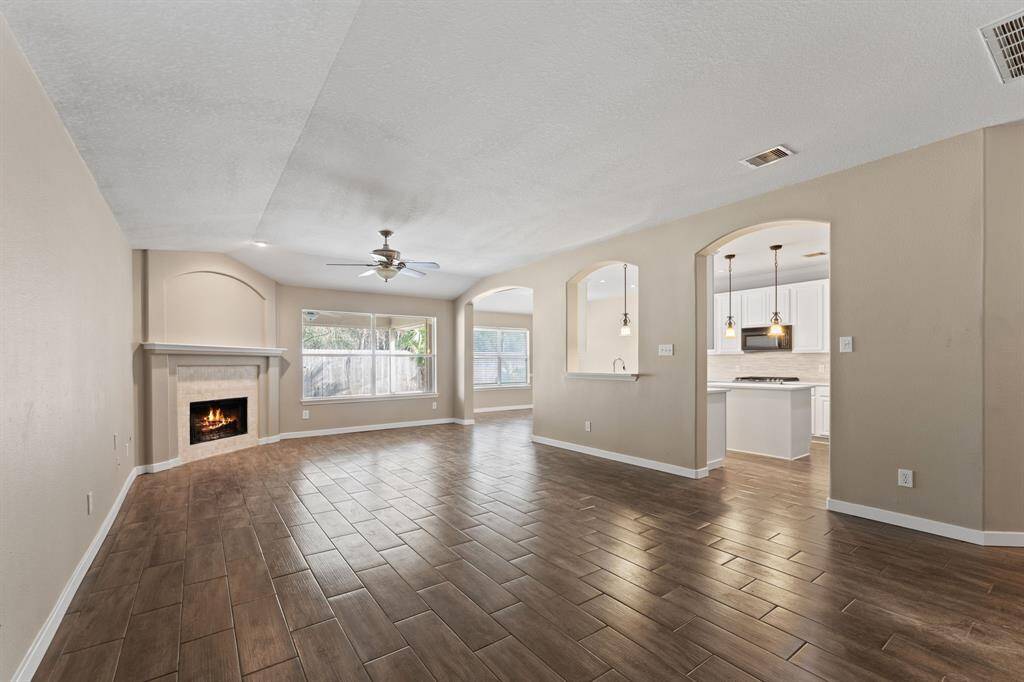 The family room opens to the kitchen and breakfast area