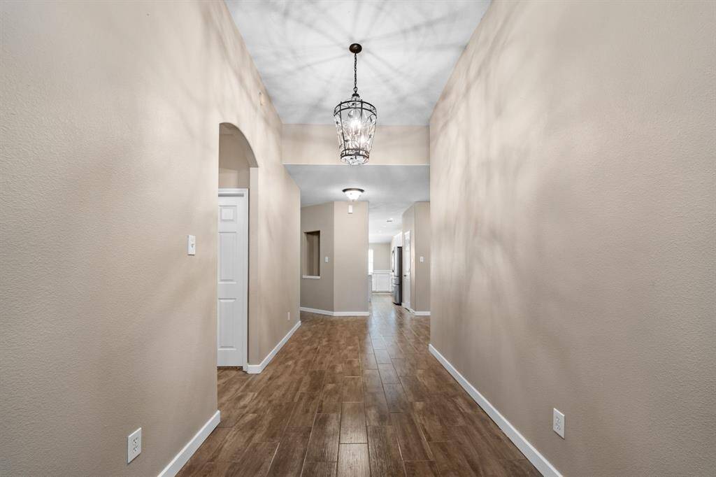 Just inside the front door is the secondary wing with 2 bedrooms, shared bathroom, and flex/gameroom