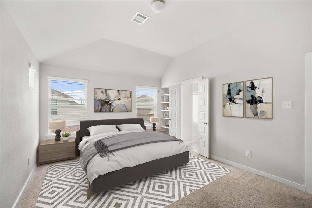 Virtually Staged: Unwind after a long day in this incredible primary bedroom! Featuring lots of natural light, carpet floors, privacy blinds, and an ensuite bathroom.