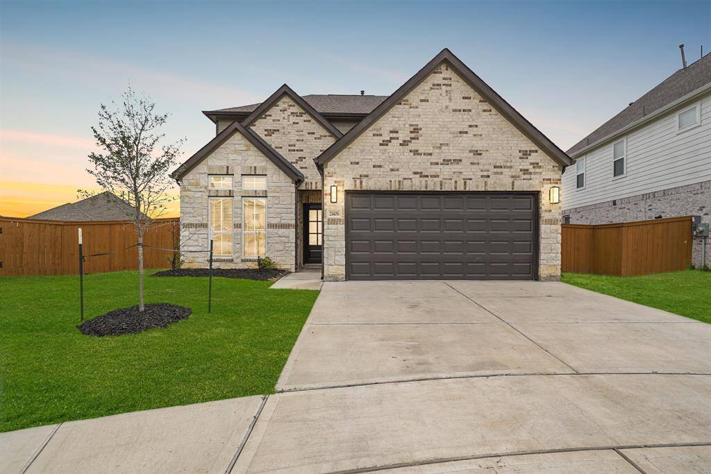 This impressive home has a fantastic curb appeal! Highlighting beautiful stone and brick exterior, a double-wide drive way, well maintained lawn and beautiful landscaping.
