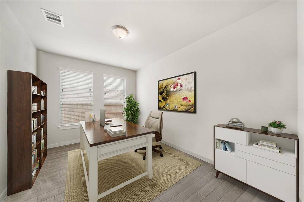 Virtually Staged: This home office is handsome and grand! Featuring tile floors, and large windows with privacy blinds.