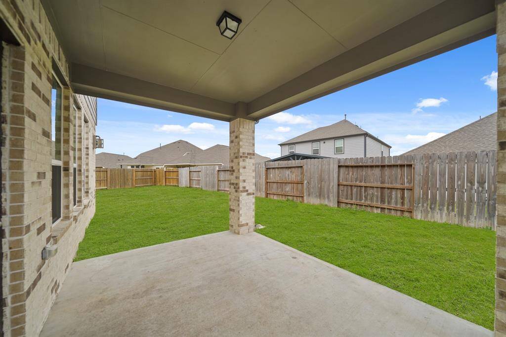 Get out from under the Texas sun, but still enjoy the great outdoors under this amazing covered patio!