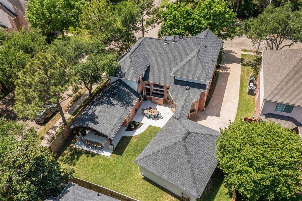 AERIEL VIEW Owners have made the most of the space on the oversized lot. Roof was replaced in March 2025. The outdoor addition seamlessly blends with the rest of the home. No wasted space here...but plentry of room left to build a pool.