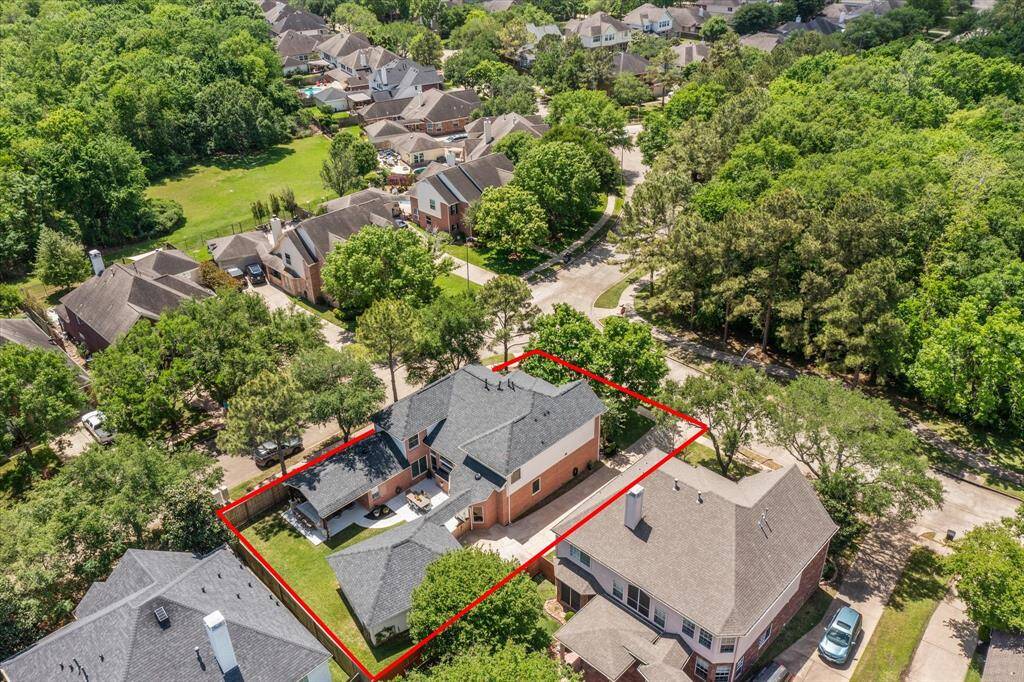 AERIAL VIEW  FRom this birdseye perspective, the prime lot position can be appreciated.  The home rests on a corner lot across from wooded preserve.