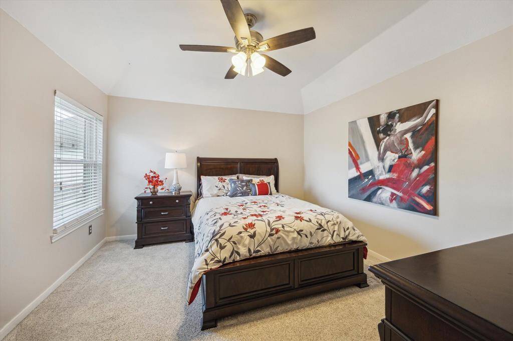 SECONDARY BEDROOM  One of three generous secondary bedroom upstairs, all have large closets and upgraded ceiling fans.  This one features and ensuite bathroom.