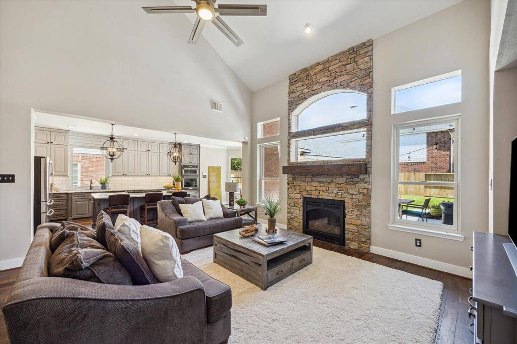 LIVING/DINING    Throught hihgly efficient Anderson Windows streams tons of natural light, filling the heart of the home with a soft glow.  Pretty nuetral designer paint color is fresh and pristine.