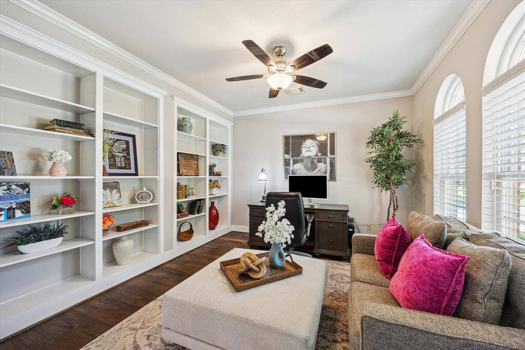 This generously-sized home office with a view of the forested greenbelt through front windows will make working from home enjoyable.  A sizable storage closet is positioned beneath the stairwell (not shown).