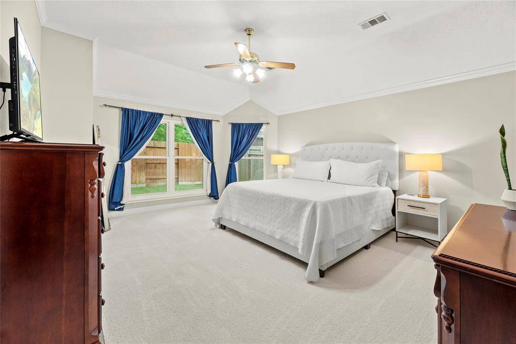 How perfect is this primary suite? Spacious and filled with natural light, this serene retreat offers the ultimate escape, promising comfort, tranquility, and pure relaxation.