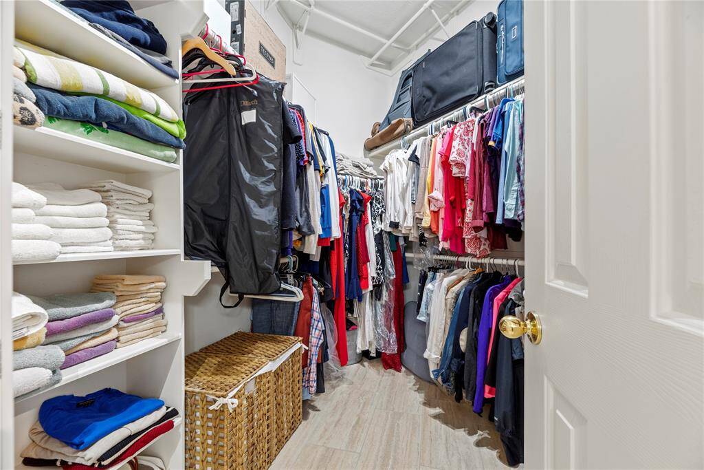 The primary closet provides generous space to store your entire wardrobe while keeping everything neatly organized and easily accessible.