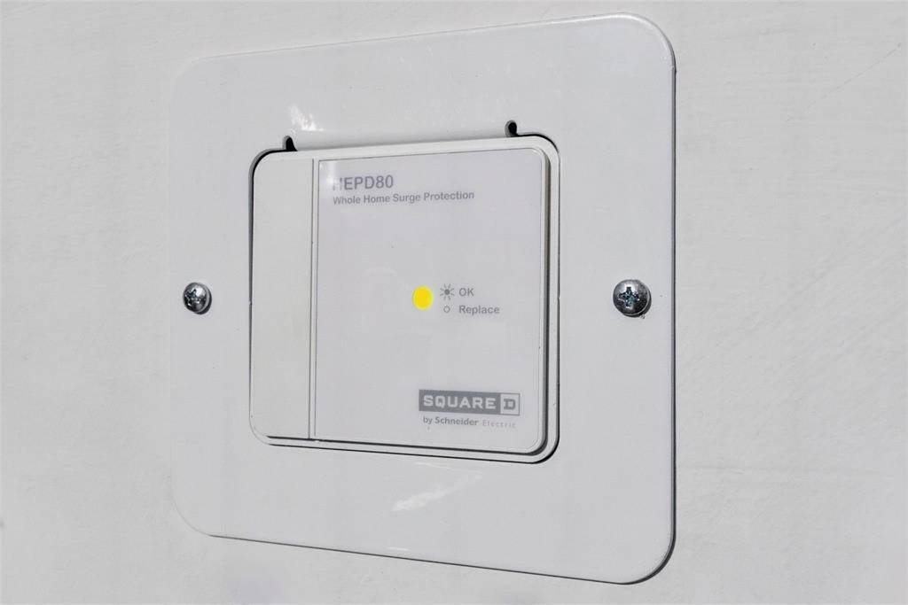 Peace of mind built in: a whole-home surge protector discreetly installed to keep  all your systems and electronics safe. This is next level protection.