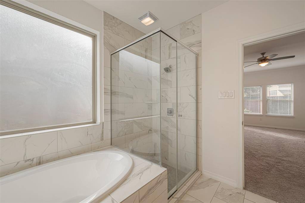 With soaking tub and separate glass-enlocsed shower