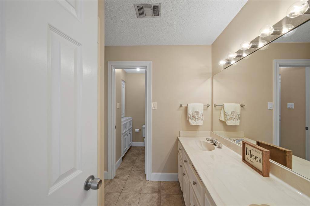 Upstairs bathroom is designed well with plenty of storage and privacy. Dual sinks are awesome for a Jack and Jill Bathroom!