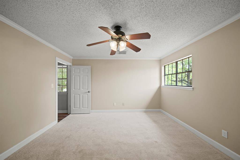 Secondary bedrooms are upstairs and feature ceiling fans, carpet and large closets.