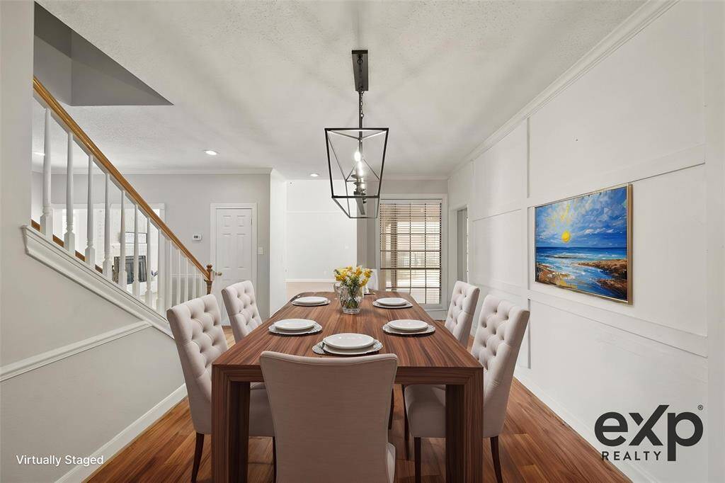 Virtually staged dining room is a great size for your table and hutch.
