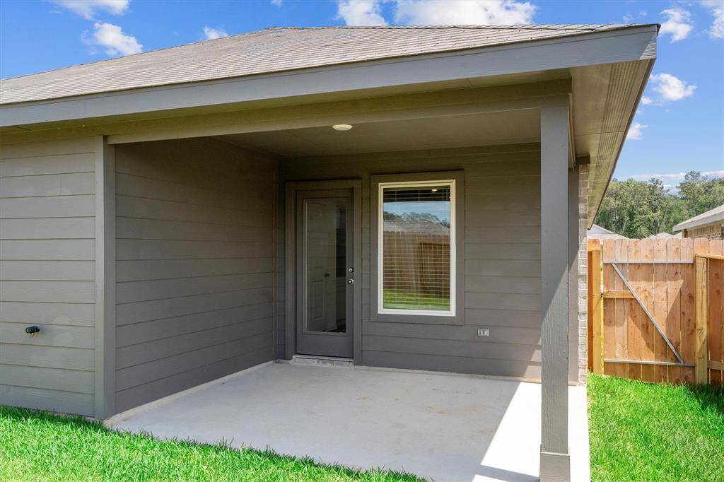 Enjoy outdoor living under a covered patio with a fully fenced backyard—ideal for pets, play, or peaceful relaxation. The yard is lush and low-maintenance, with privacy fencing on all sides.