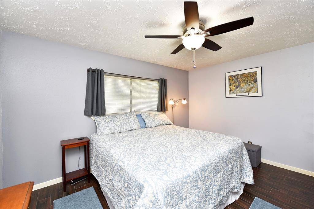 The primary bedroom has 2 closets and is positioned at the rear of the home.  The ceiling fan was recently updated.