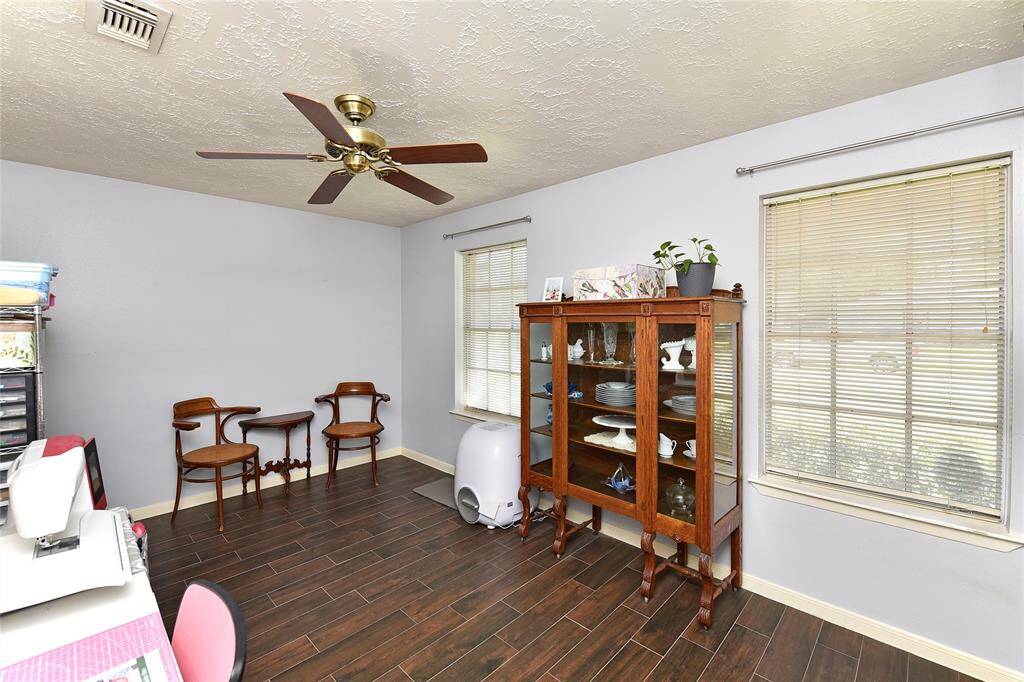Another secondary bedroom is being used as a sewing room. This room has great natural light and a nice sized closet.