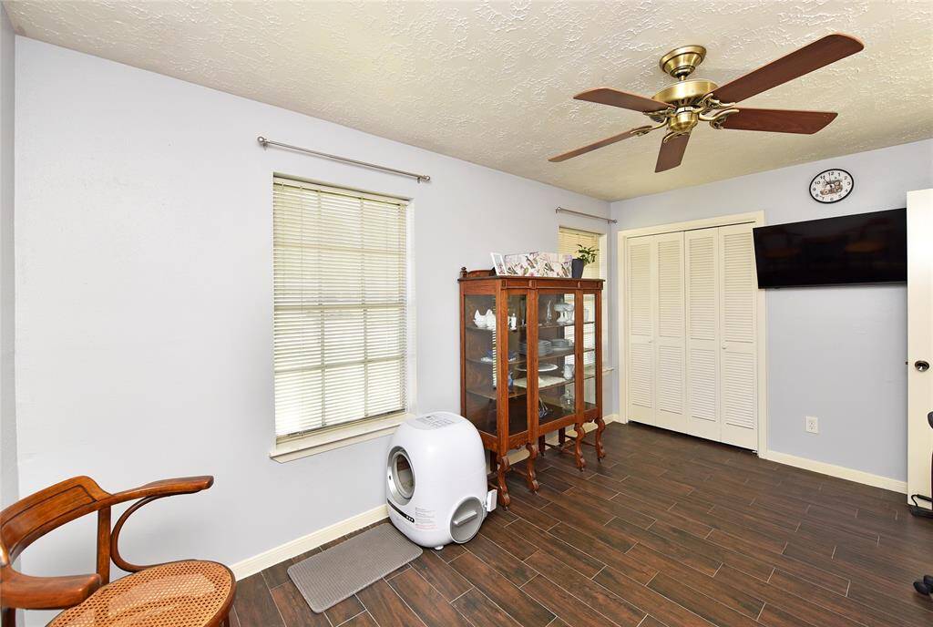 Reverse view of the secondary bedroom. The owner will take the T.V., but leave the mount for the buyer's use.