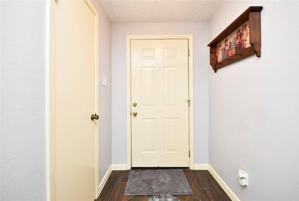 The foyer starts you out with durable, easy care wood-look tile flooring