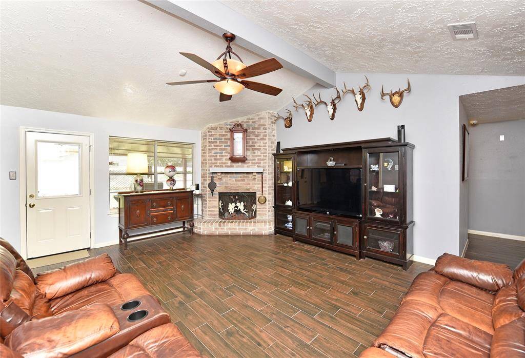Another view of the family room with views of the covered patio and yard.