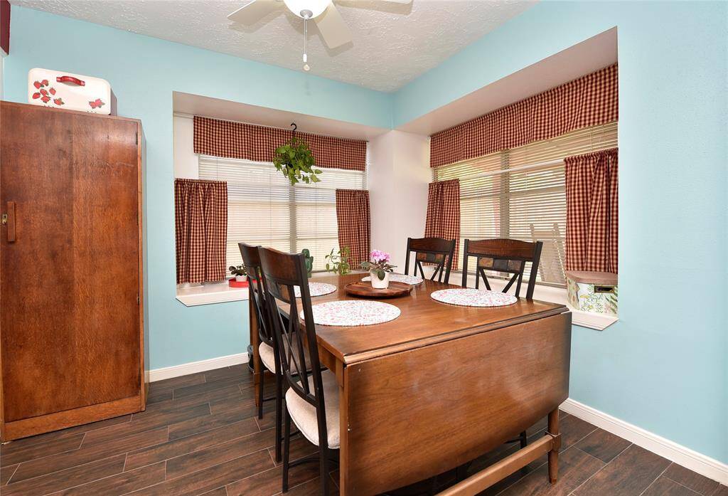 The dining area has bay window boxes that make a great seating area or spot for your plants.