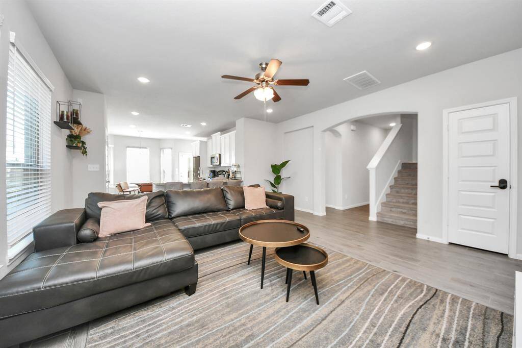 Living area leads to Primary bedroom and stairs