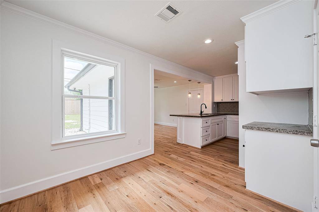 Breakfast area features lots of nature light and New wood flooring