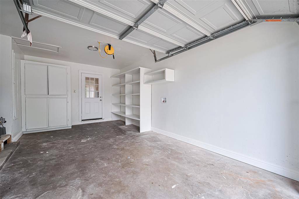 Garage features plenty of storage space and shelves. Wash/dryer connections