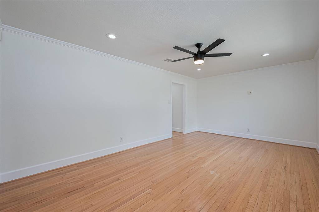 Living room also features newly refinished wood floors.