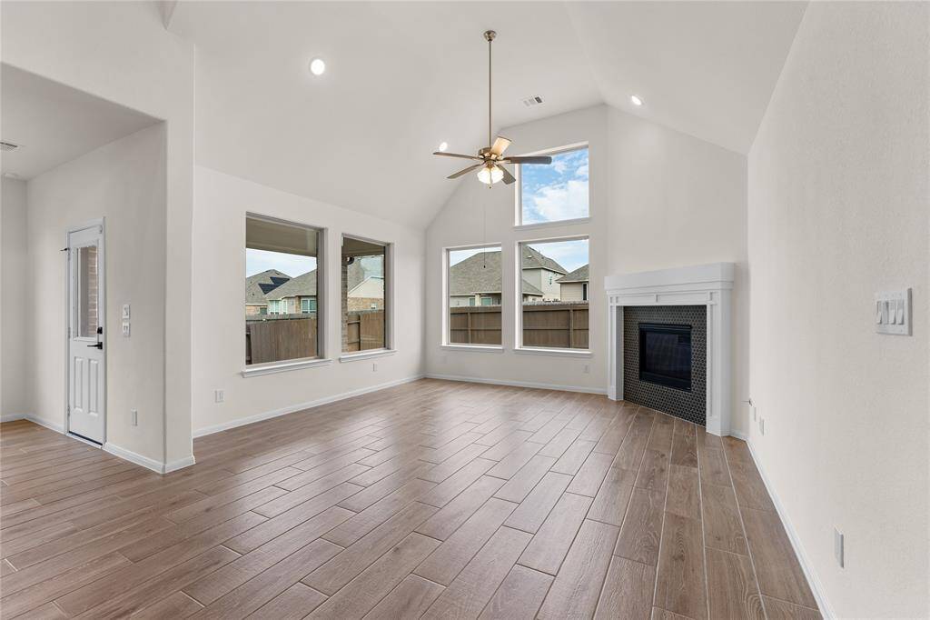 The wood-look tile flooring carries throughout the downstairs living spaces