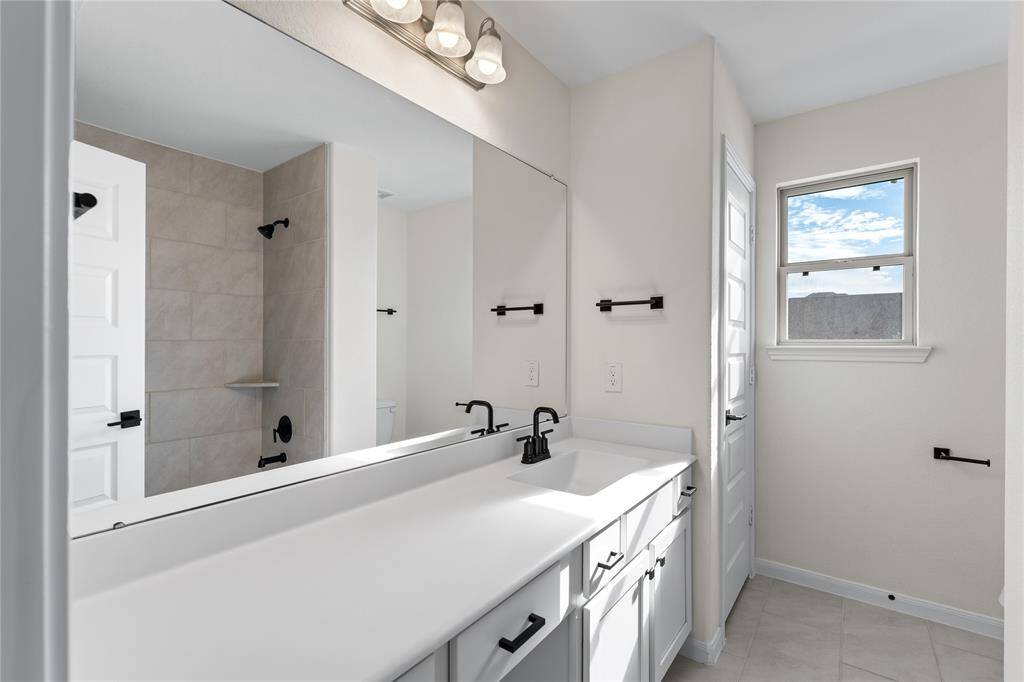 One of two full bathrooms upstairs