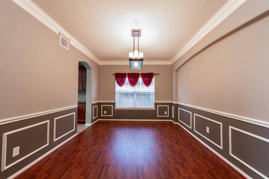 Elegant dining room with direct kitchen access for seamless entertaining.