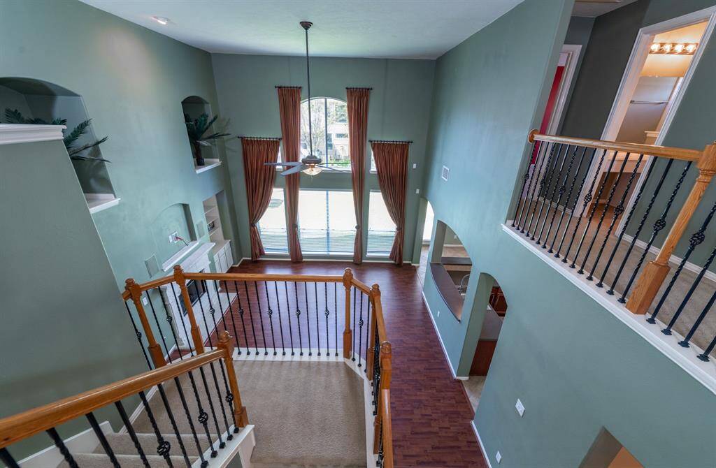 Enjoy a stunning vantage point from the upstairs, overlooking the spacious and inviting family room.