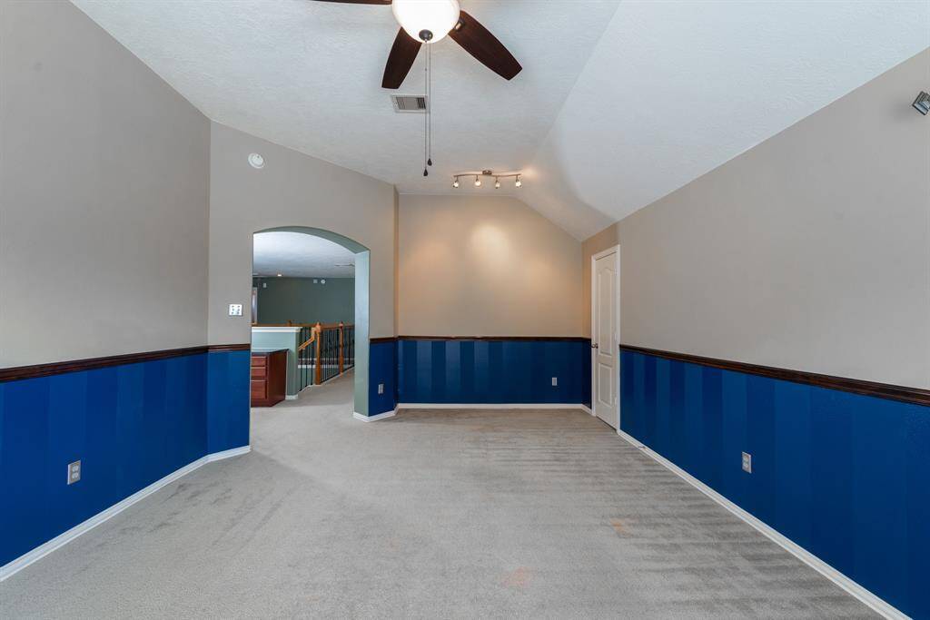 Ideal media room for sports enthusiasts or a versatile space for homeschooling.