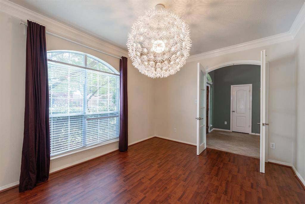 Versatile space perfect as a formal living room or a cozy study.