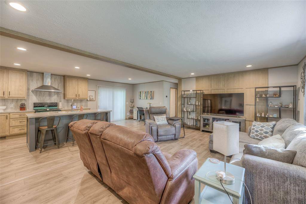 Another view of open concept living area and kitchen