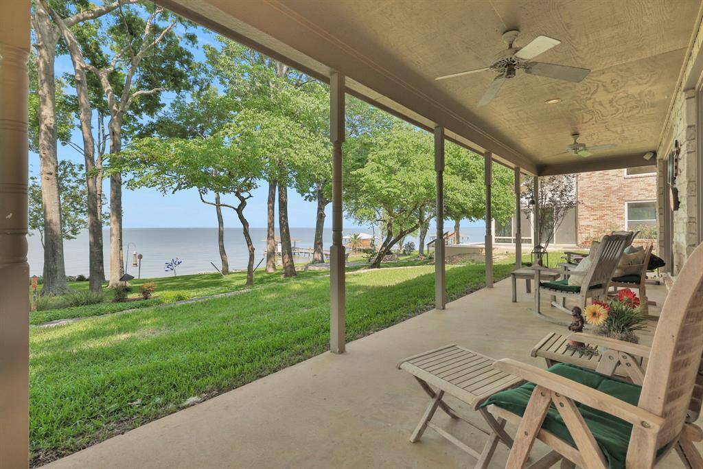 Flow out from the living area to the covered back patio - relax in the shade and take in the view