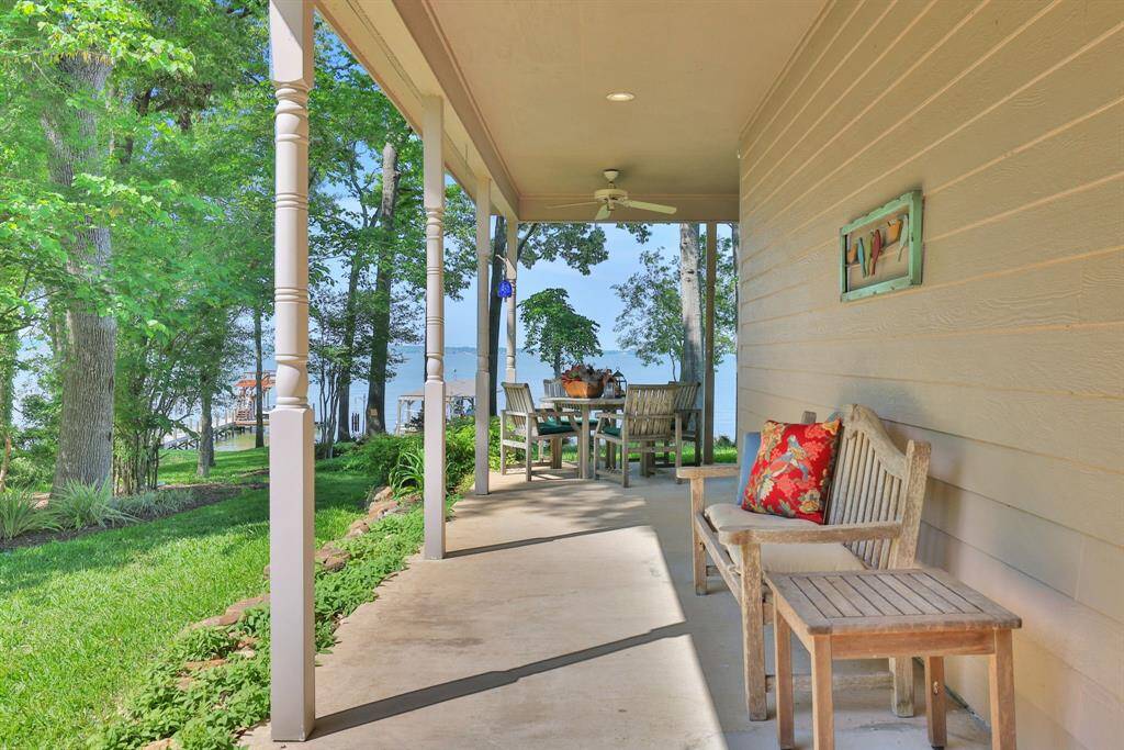 The covered area wraps around one side of the home