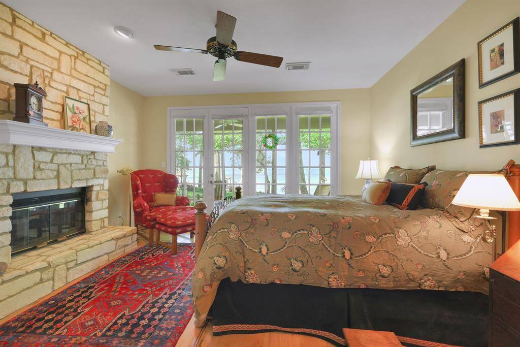 The see through fireplace adds style and serenity to the primary bedroom